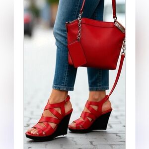 Black Rivet salmon red bag, silver hardware and lots of storage spaces for you.